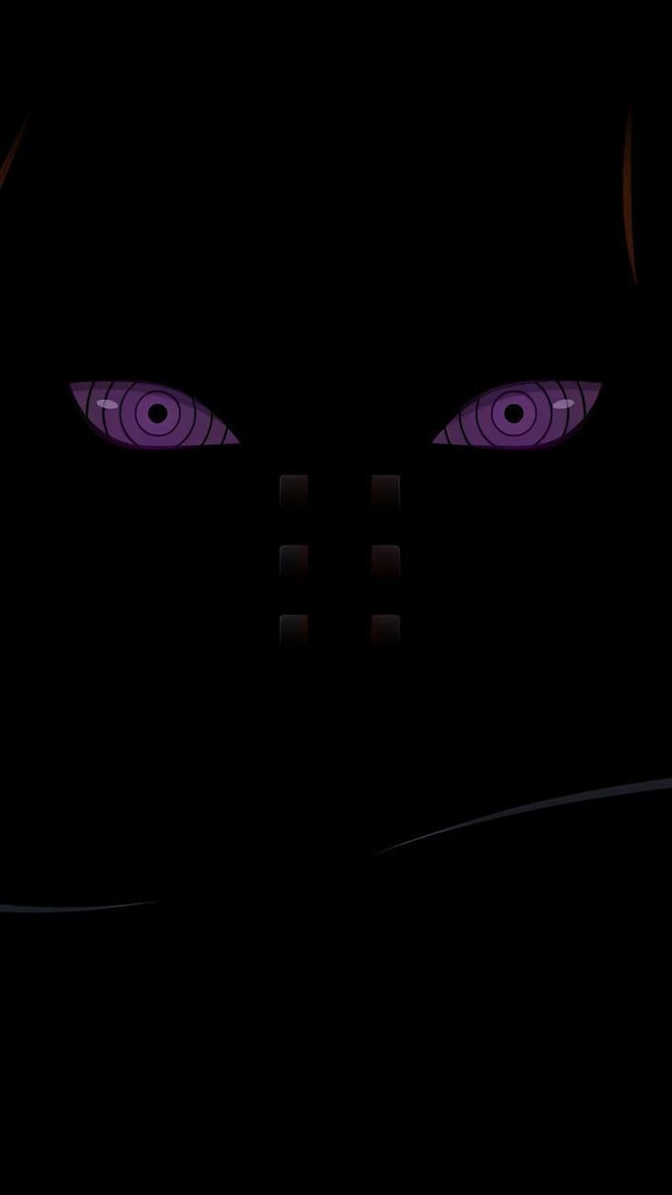 This may contain: an evil looking woman's eyes glowing in the dark with purple light on her face