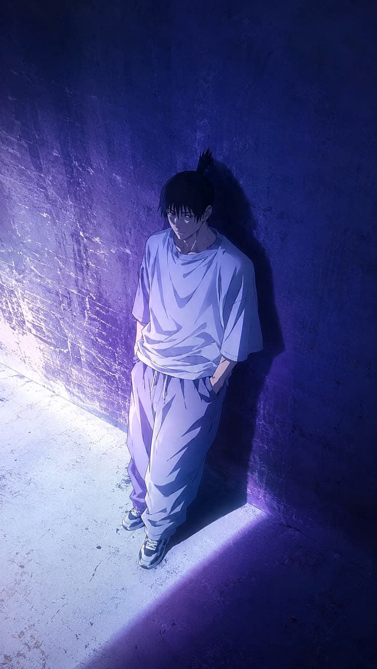 a man standing next to a brick wall